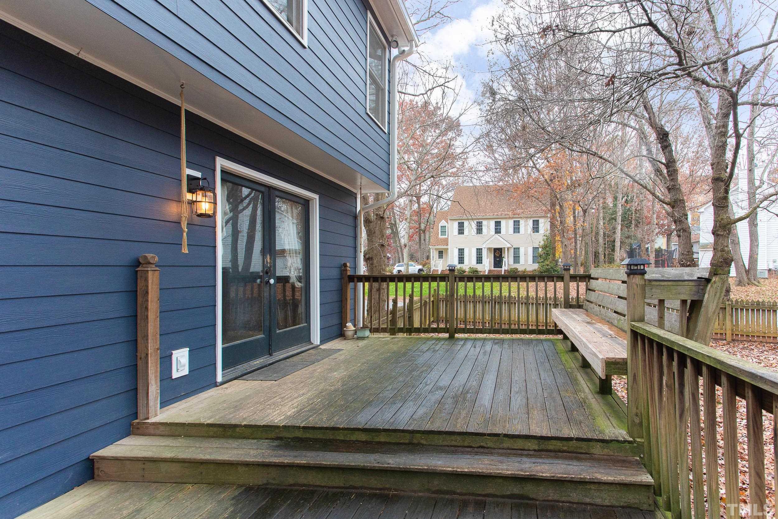 2501 Diamondhitch Trail Raleigh, NC 27615 - Photo 7 of 21 a view of a wooden deck and a yard