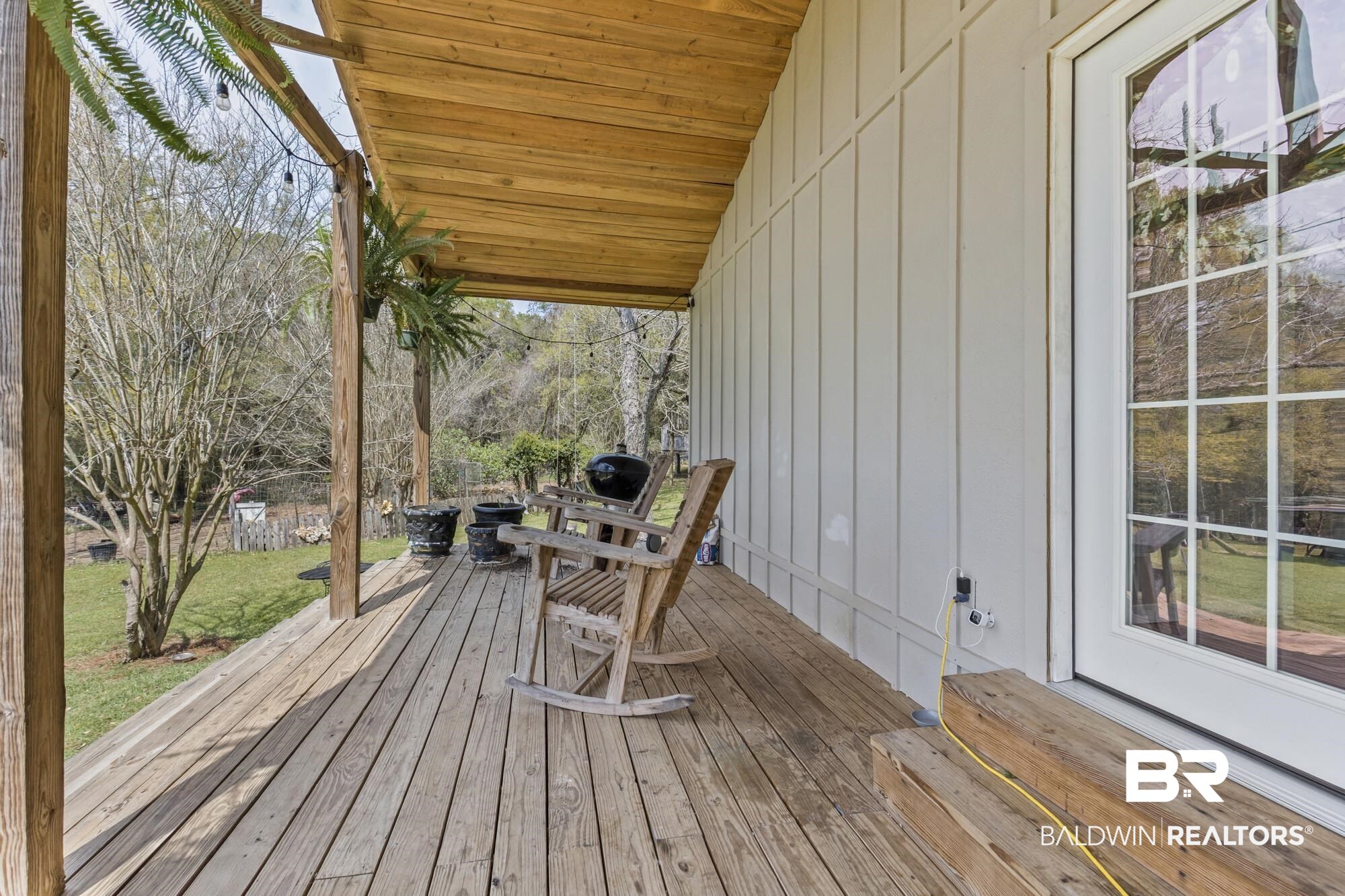 11100 Rhett McConnell Road Theodore, AL 36582 - Photo 20 of 47 Wooden terrace featuring a yard
