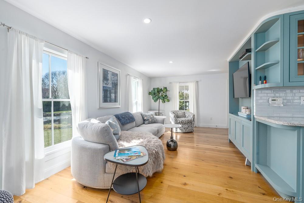 19000 Main Road Mattituck, NY 11952 - Photo 5 of 32 Living room featuring light wood finished floors, recessed lighting, and baseboards