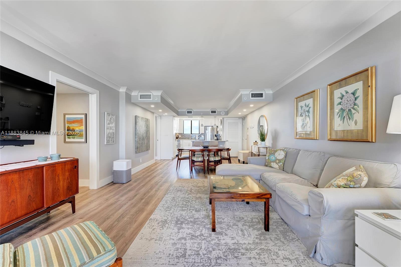 200 Ocean Trail Way, Unit 701 Jupiter, FL 33477 - Photo 19 of 27 a living room with furniture and a flat screen tv