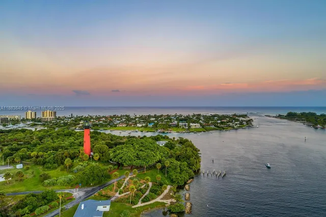 an aerial view of a house and a yard