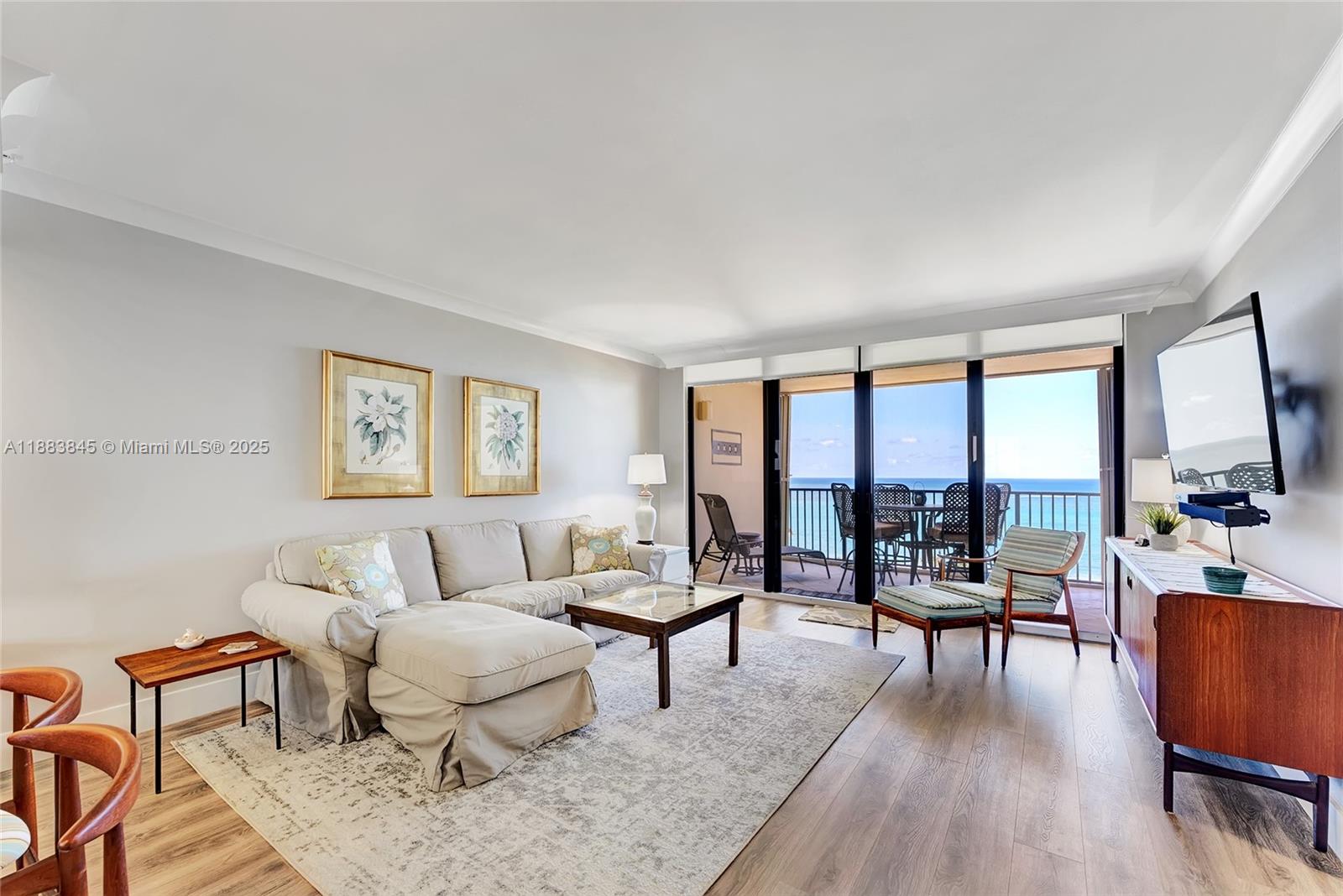 200 Ocean Trail Way, Unit 701 Jupiter, FL 33477 - Photo 3 of 27 a living room with furniture and a large window