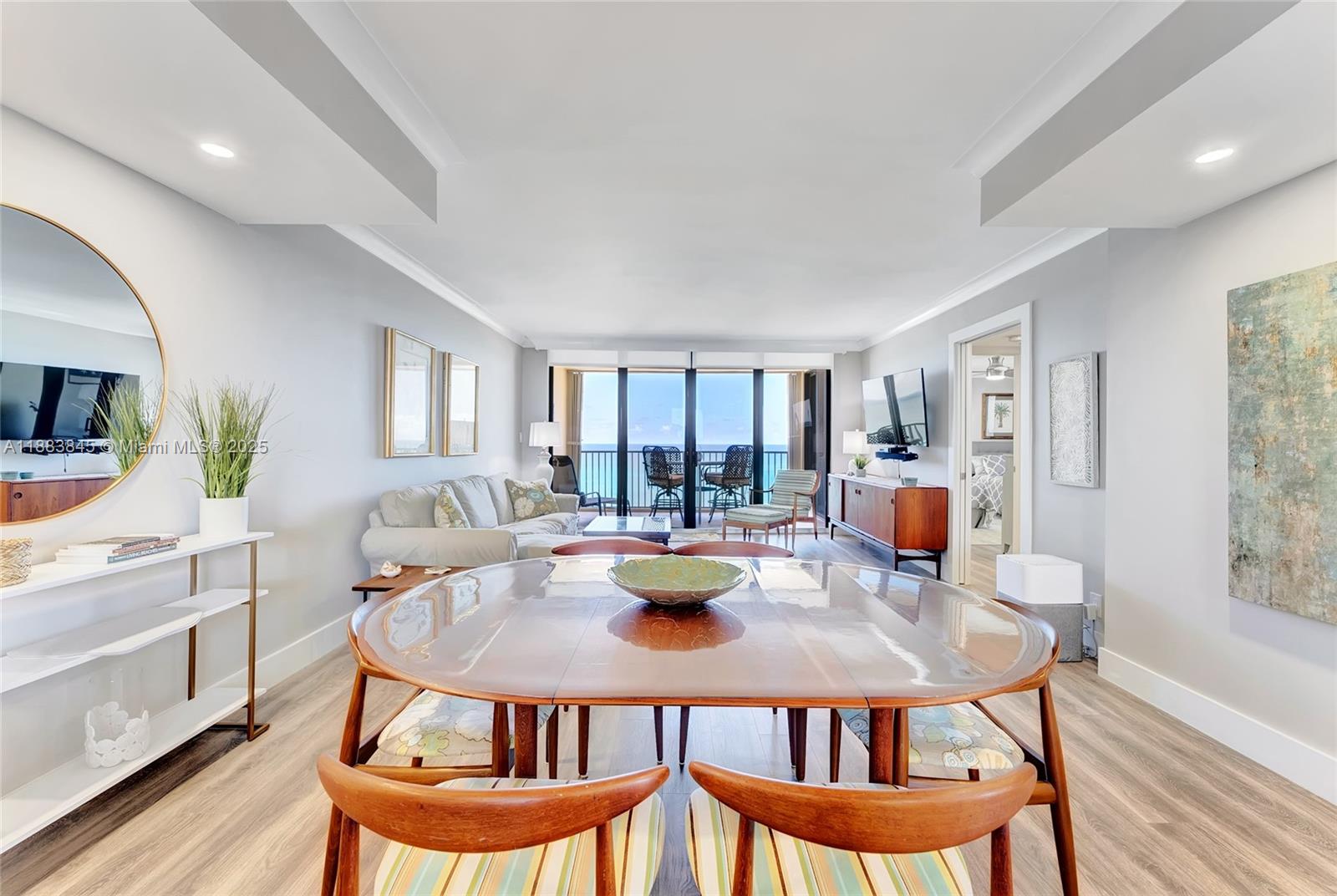 200 Ocean Trail Way, Unit 701 Jupiter, FL 33477 - Photo 9 of 27 a dining room with furniture and wooden floor