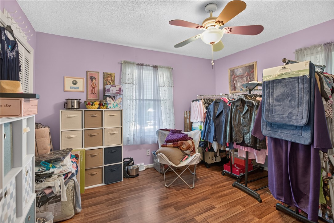 104 Laurel Lane Seneca, SC 29678 - Photo 18 of 36 Hardwood floors and a ceiling fan create a comfortable atmosphere in this adaptable room.