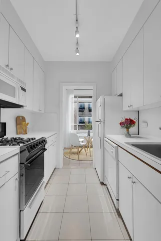 a black and white photo of a living room