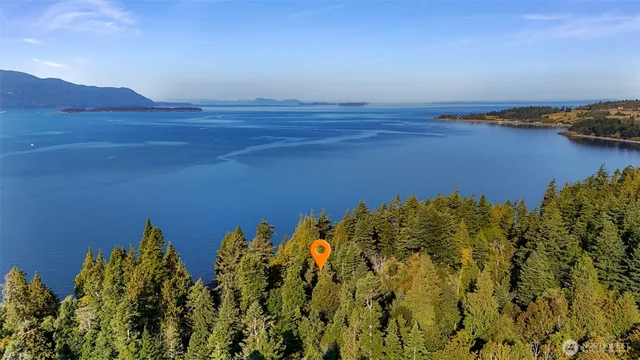 an aerial view of a residential houses with outdoor space and garden
