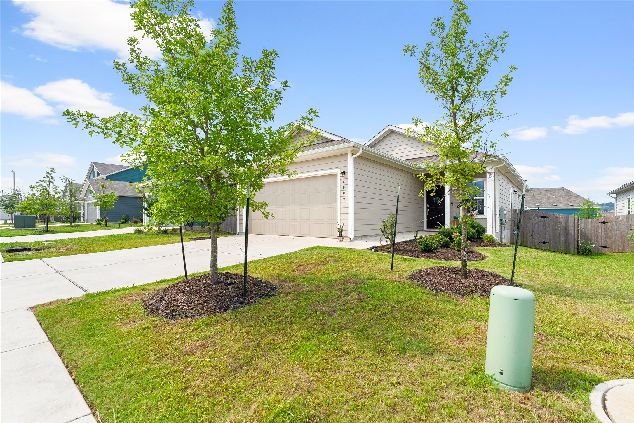 6009 Jagger Avenue Austin, TX 78747 - Photo 4 of 24 a house with swimming pool in front of it