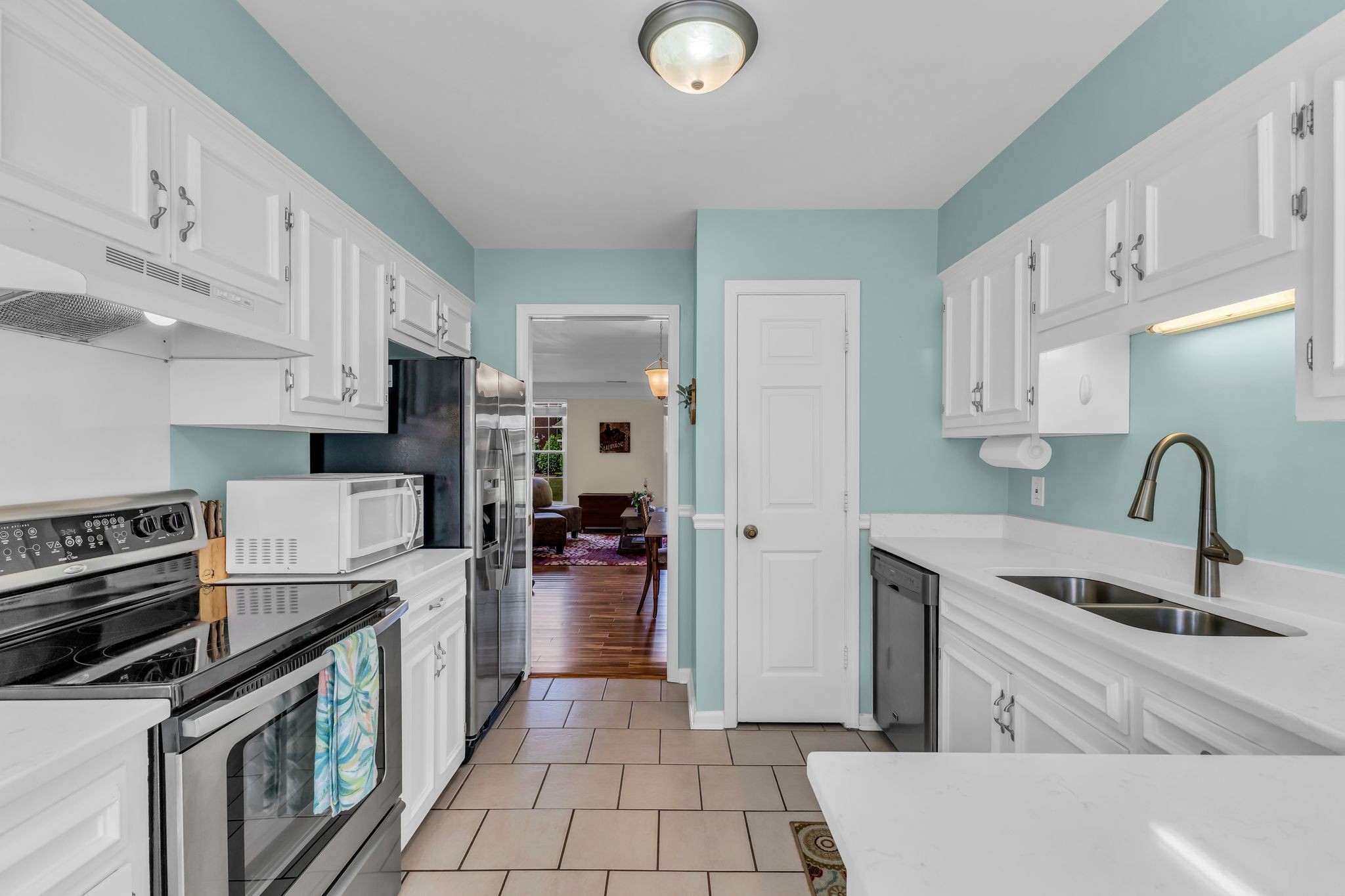 824 General George Patton Road Nashville, TN 37221 - Photo 17 of 35 a kitchen with stainless steel appliances granite countertop a sink and cabinets