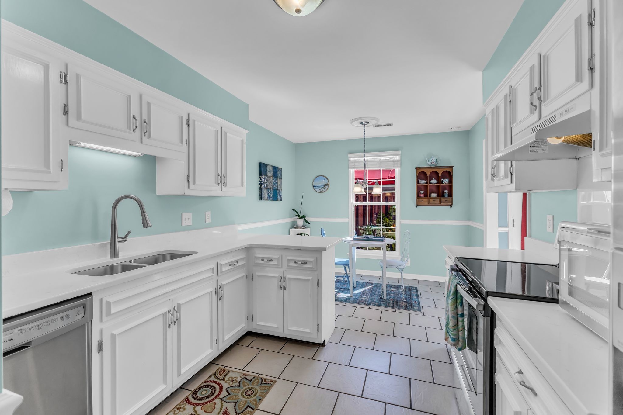 824 General George Patton Road Nashville, TN 37221 - Photo 20 of 35 a kitchen with a sink stove and cabinets