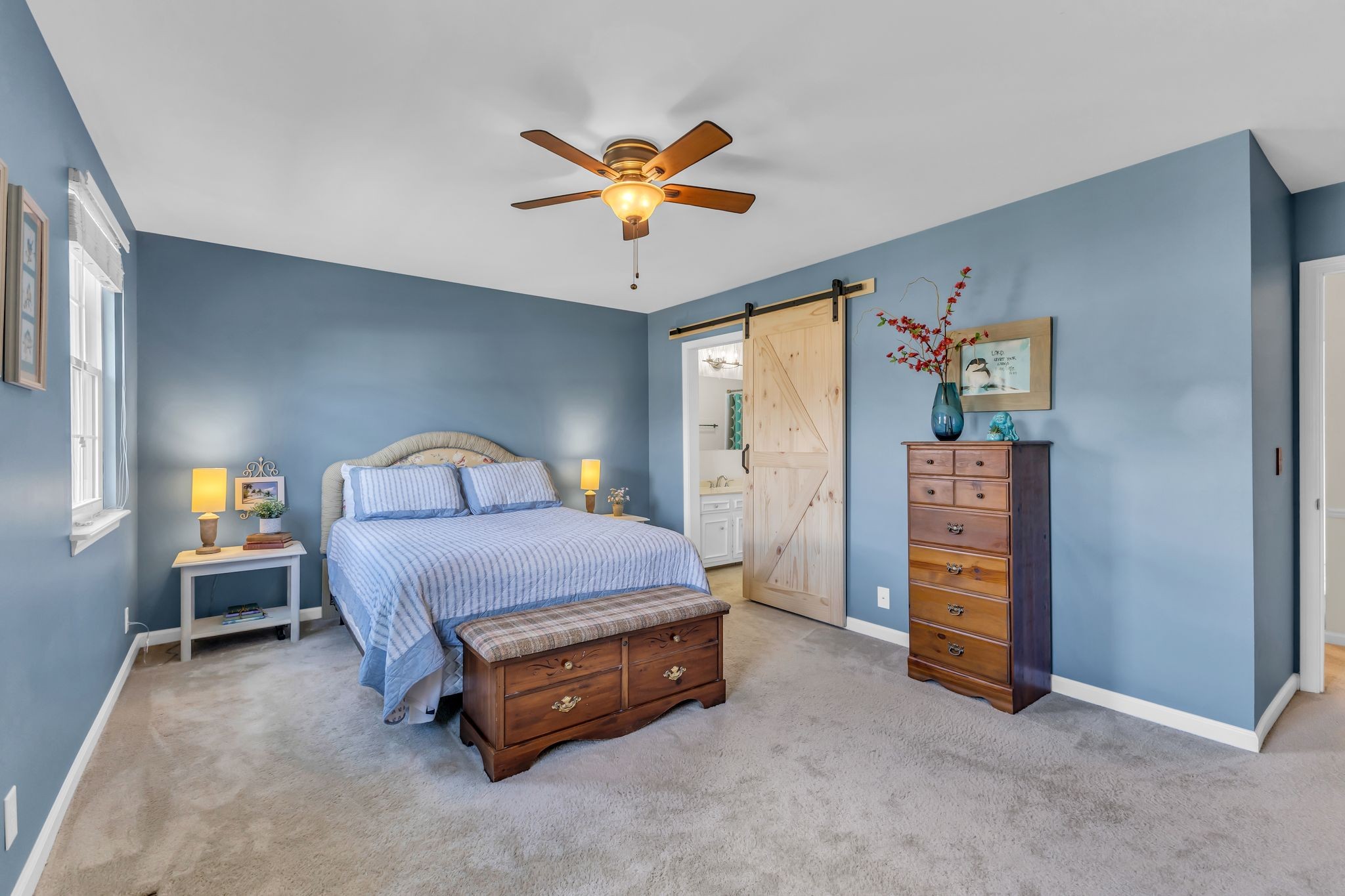 824 General George Patton Road Nashville, TN 37221 - Photo 23 of 35 a spacious bedroom with a bed and a ceiling fan