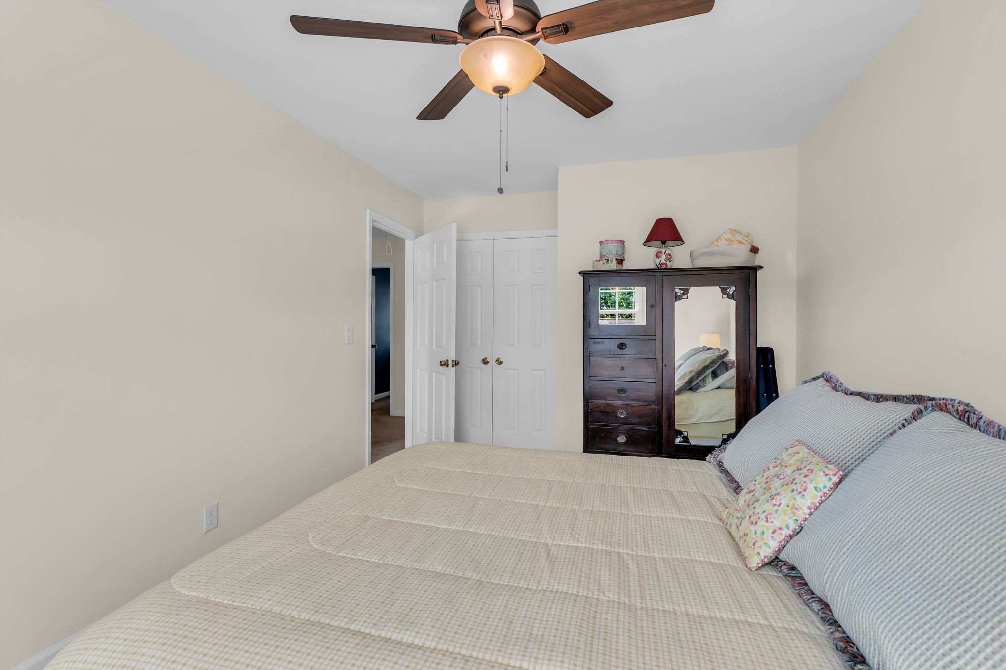824 General George Patton Road Nashville, TN 37221 - Photo 27 of 35 a bedroom with a bed and a chandelier