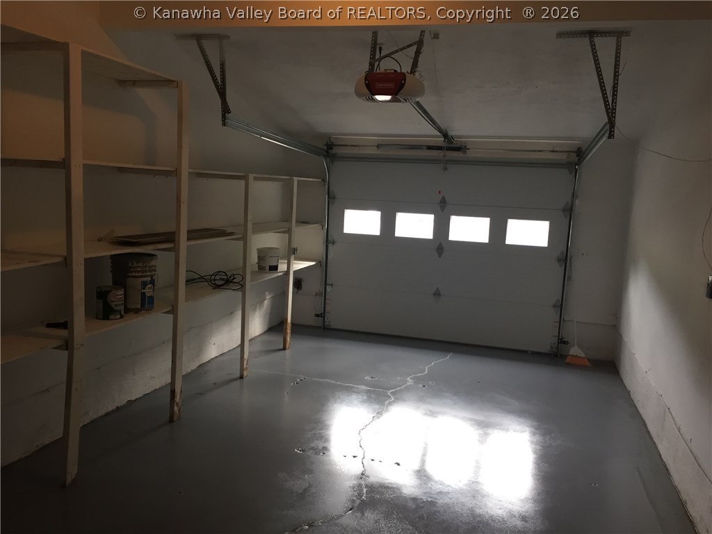 402 Powderhorn Road Charleston, WV 25314 - Photo 28 of 29 the garage has just been painted. storage shelves stay.
