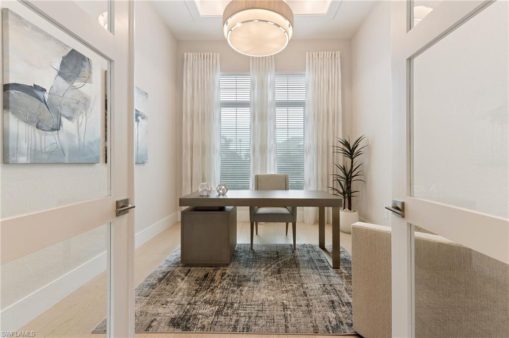 8916 Nevis Way Naples, FL 34112 - Photo 17 of 50 a view of a workspace with furniture and a window