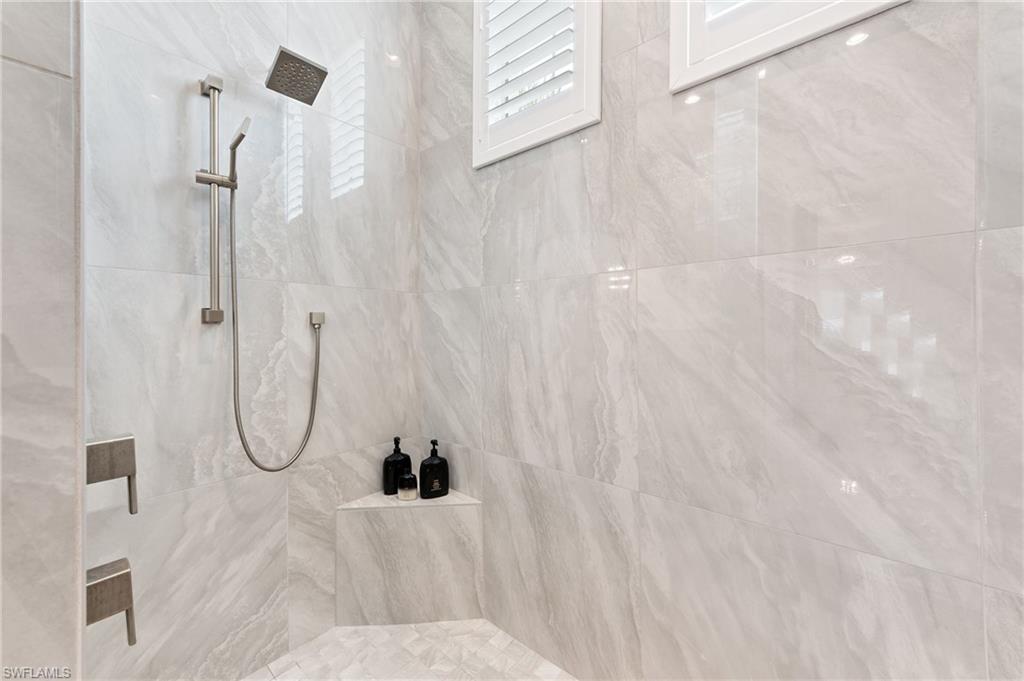 8916 Nevis Way Naples, FL 34112 - Photo 23 of 50 a bathroom with a shower