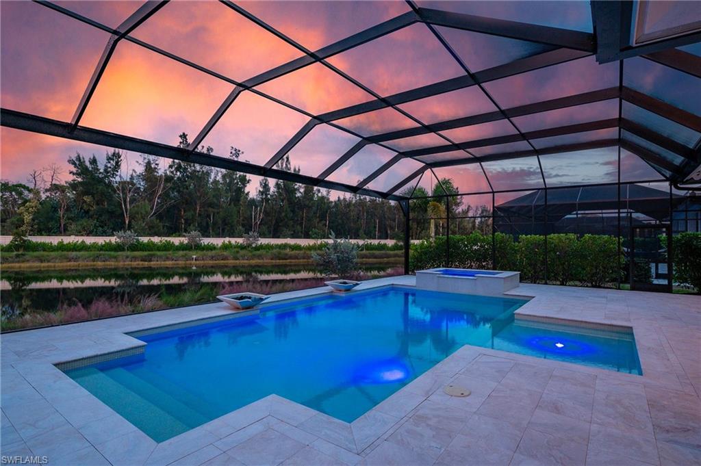 8916 Nevis Way Naples, FL 34112 - Photo 39 of 50 a view of a backyard with swimming pool