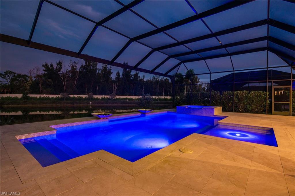 8916 Nevis Way Naples, FL 34112 - Photo 41 of 50 a view of outdoor space with pool and furniture