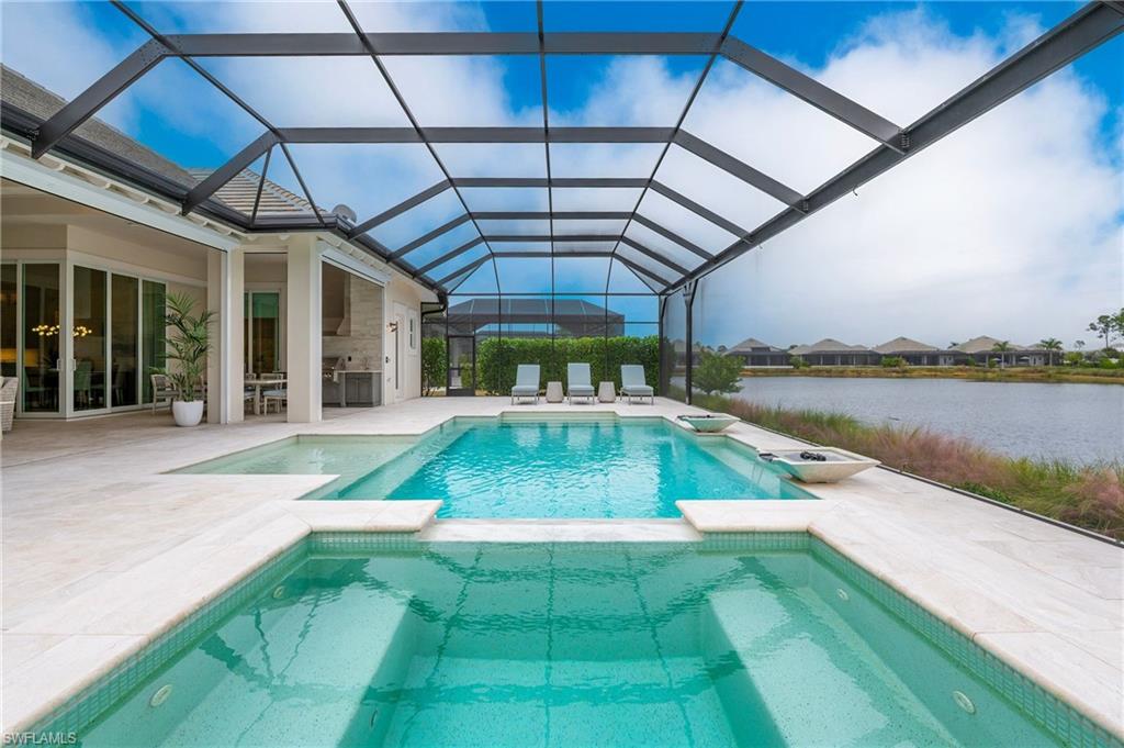 8916 Nevis Way Naples, FL 34112 - Photo 42 of 50 a view of a backyard with swimming pool