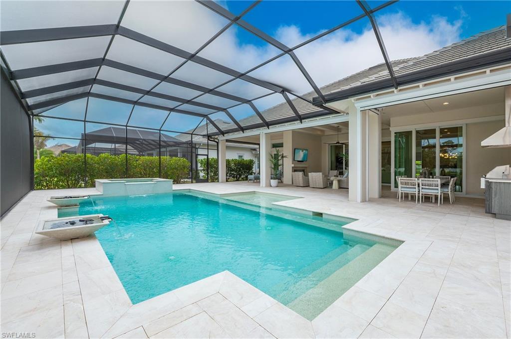 8916 Nevis Way Naples, FL 34112 - Photo 44 of 50 a view of a swimming pool with a patio