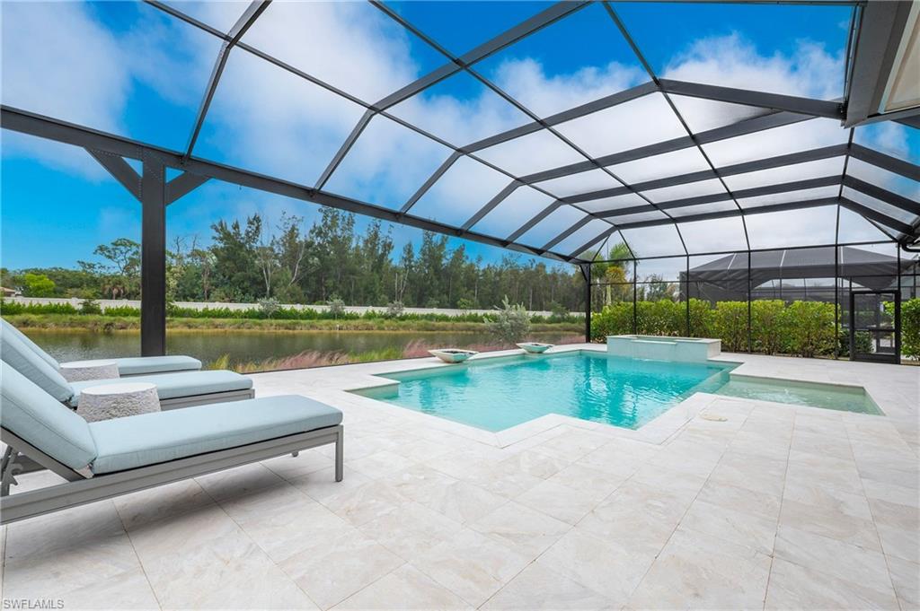 8916 Nevis Way Naples, FL 34112 - Photo 45 of 50 a view of swimming pool with a patio