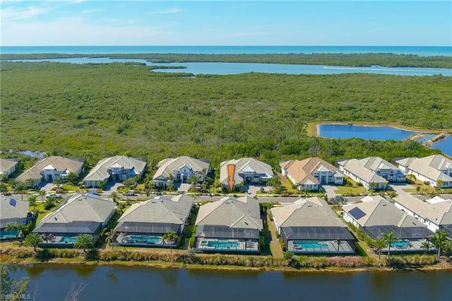 a aerial view of residential houses with outdoor space
