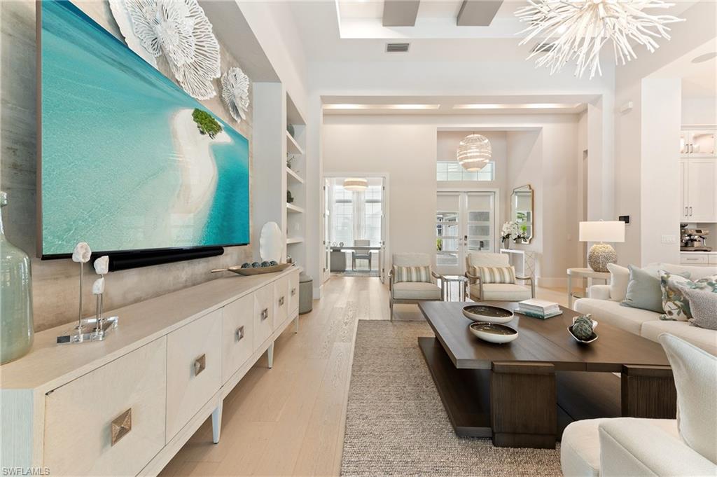 8916 Nevis Way Naples, FL 34112 - Photo 8 of 50 a large bathroom with a double vanity sink and a mirror