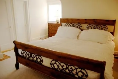 a bedroom with a bed and a dresser