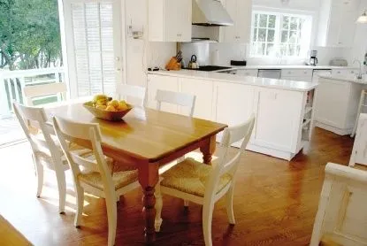 a view of a dining room with furniture and a window