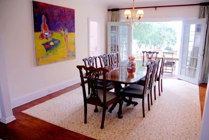 Undisclosed Address Bridgehampton, NY 11976 - Photo 7 of 19 a view of a dining room with furniture a chandelier and wooden floor
