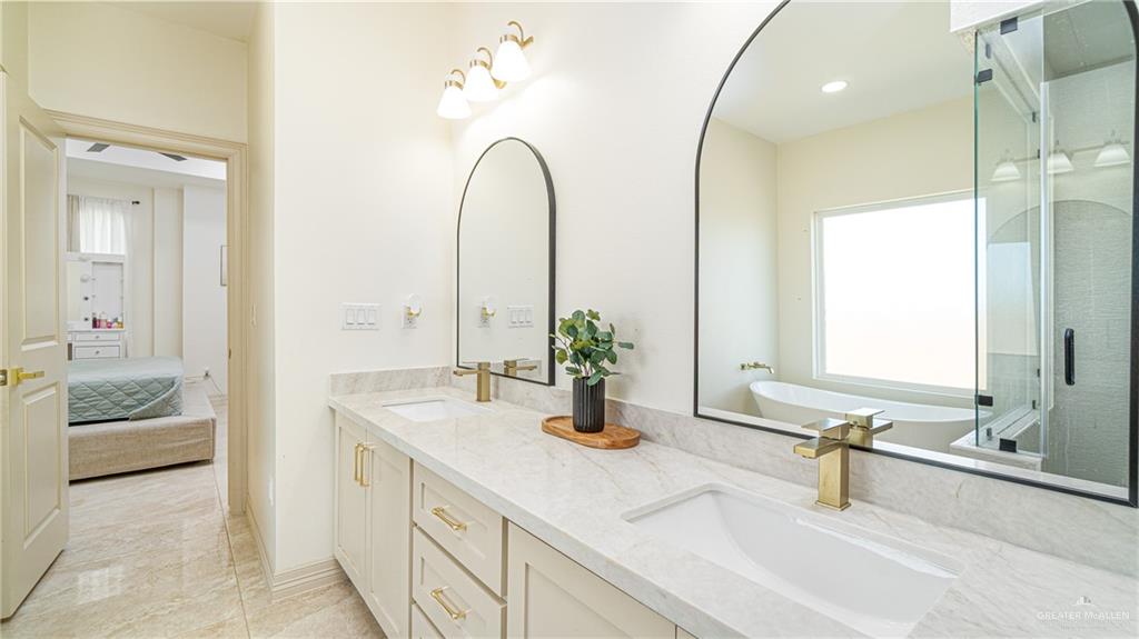 21325 Hibiscus Street Edcouch, TX 78538 - Photo 12 of 17 a en suite bathroom with a sink and a mirror