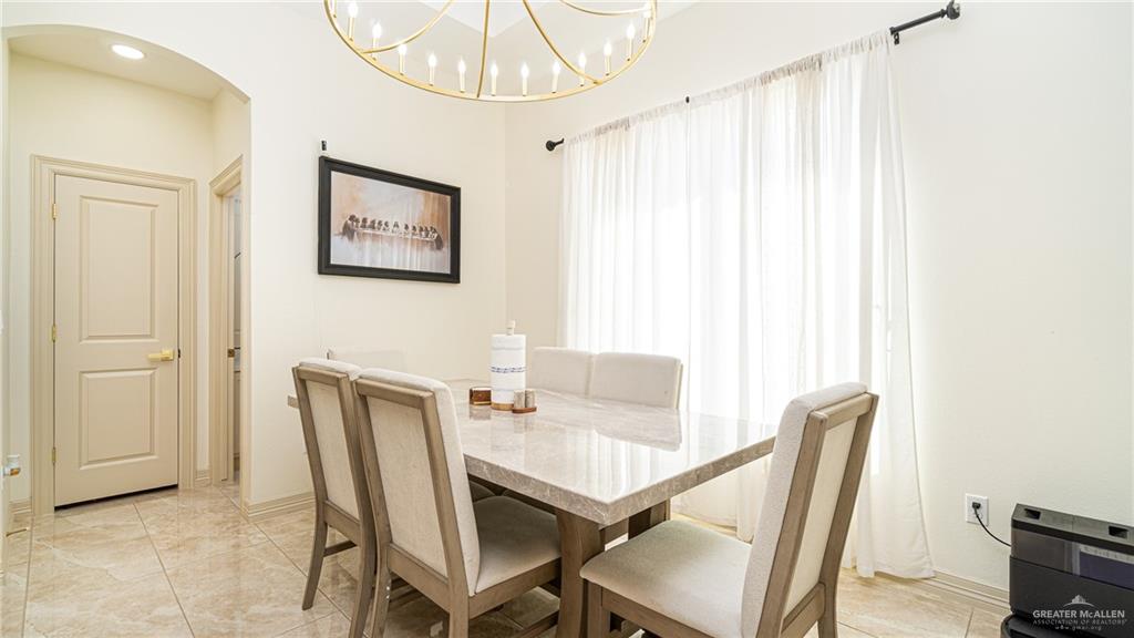 21325 Hibiscus Street Edcouch, TX 78538 - Photo 5 of 17 a view of a dining room with furniture and a chandelier