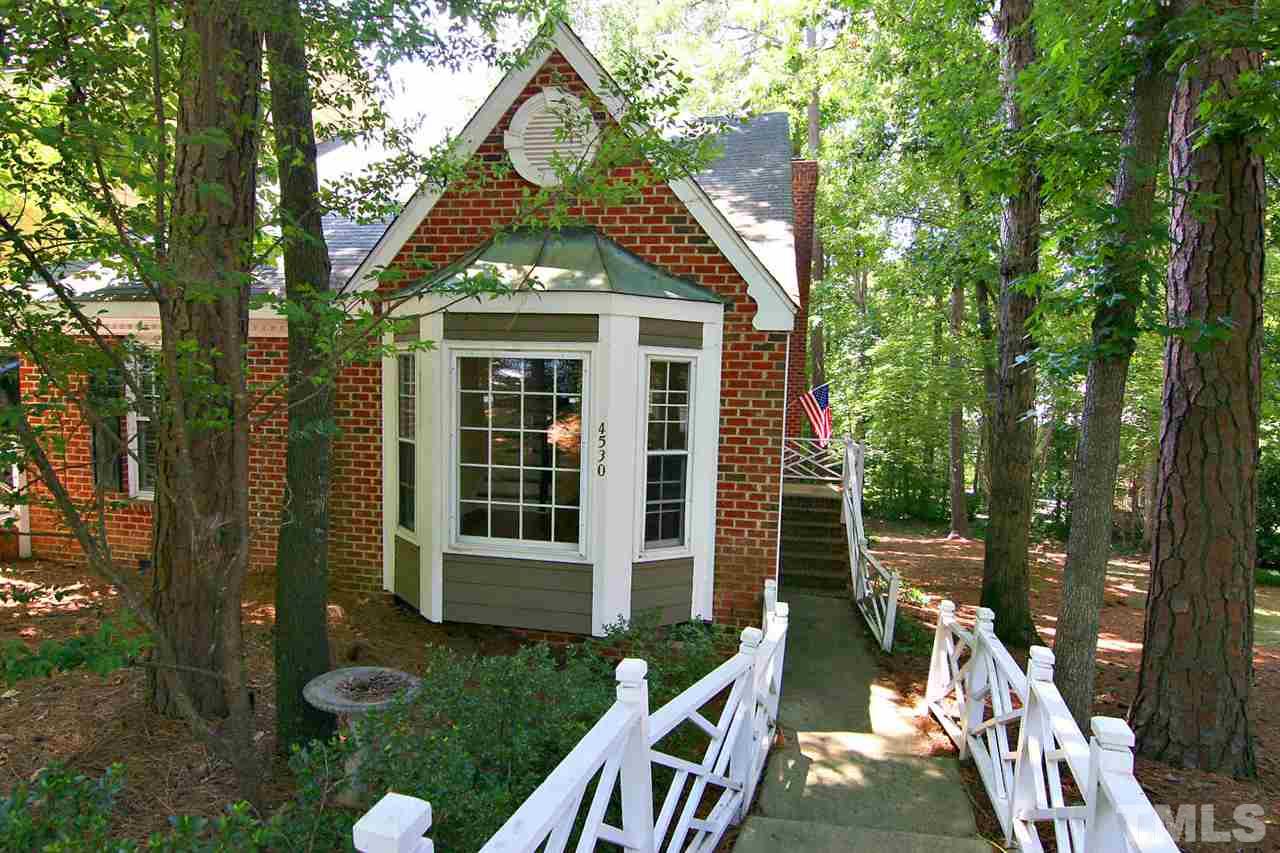 4530 Hamptonshire Drive Raleigh, NC 27613 - Photo 1 of 20 a front view of a house with a yard