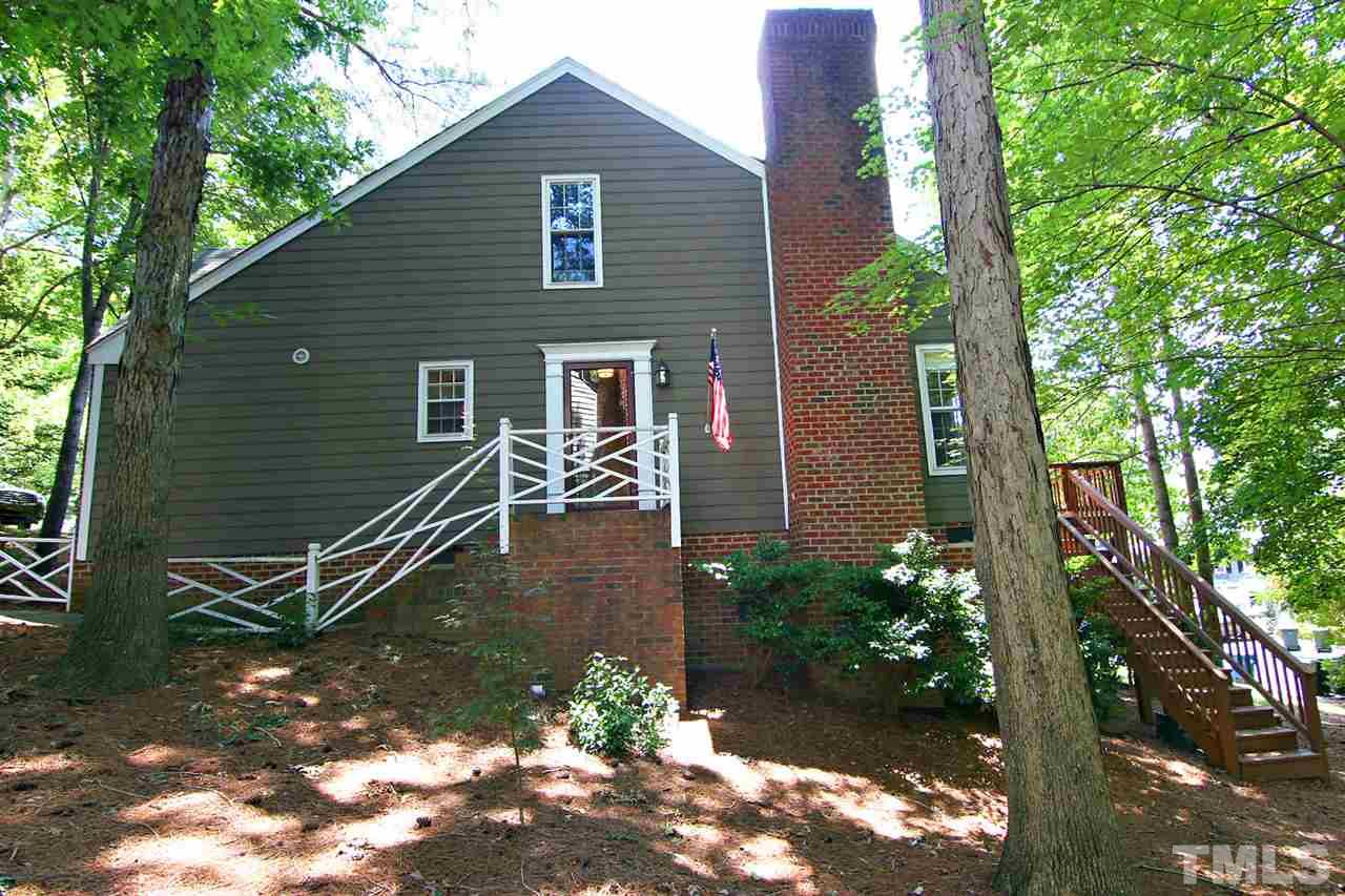 4530 Hamptonshire Drive Raleigh, NC 27613 - Photo 15 of 20 a backyard of a house with lots of green space