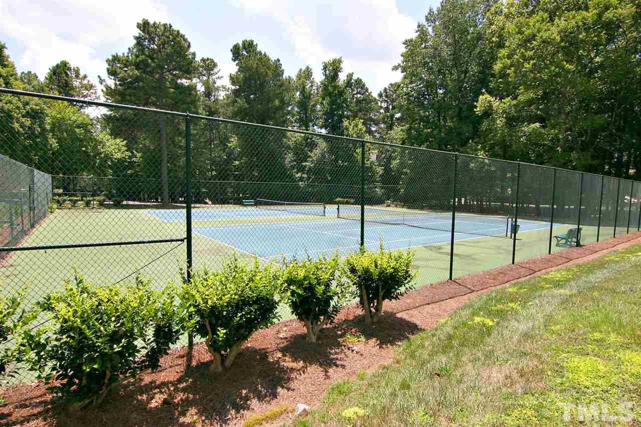 4530 Hamptonshire Drive Raleigh, NC 27613 - Photo 18 of 20 a view of a backyard with potted plants