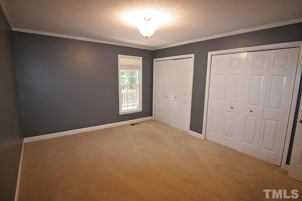4530 Hamptonshire Drive Raleigh, NC 27613 - Photo 8 of 20 an empty room with windows and closet