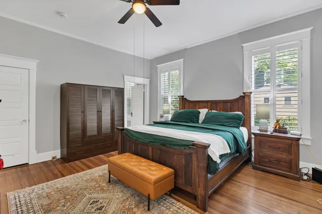 a bedroom with a bed and a fireplace