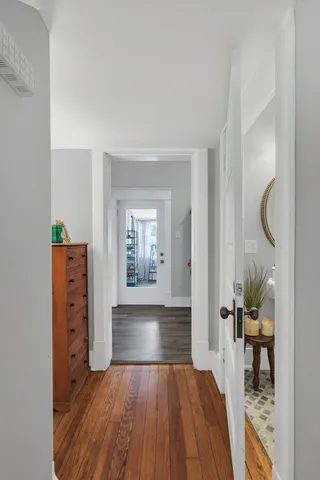 a bathroom with a sink mirror and toilet