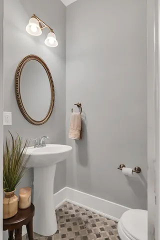 a view of living room with furniture and wooden floor