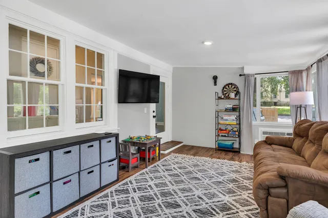 a view of a livingroom with furniture and wooden floor
