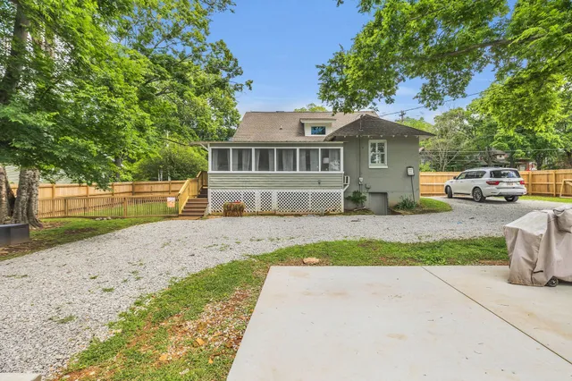 a view of a car park in front of house
