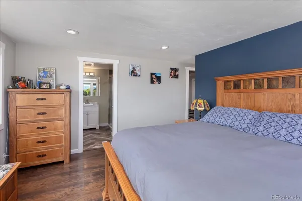 a bedroom with a bed and a dresser