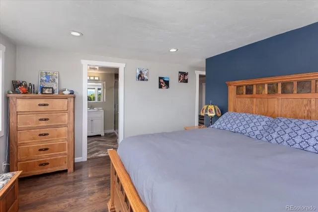 a bedroom with a bed and a dresser