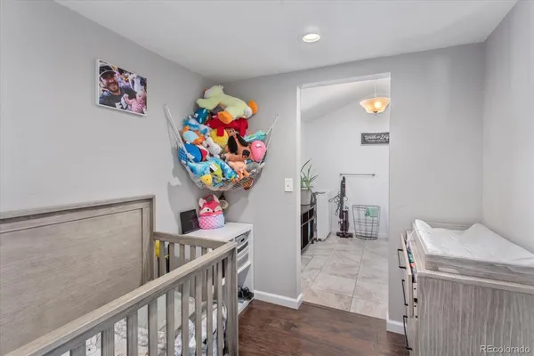a view of a hallway with a dining table