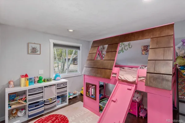 a room with furniture and a book shelf