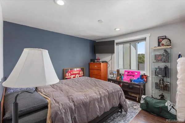a bedroom with a bed and a lamp