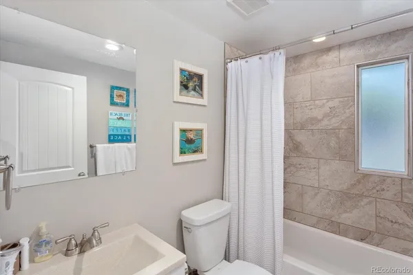 a living room with furniture and decor