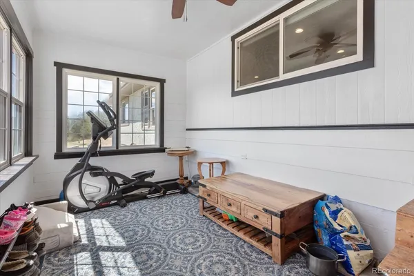 a living room with a couch a table and a large window