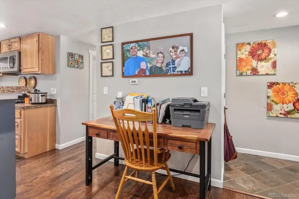 a view of a dining room with furniture and wooden floor