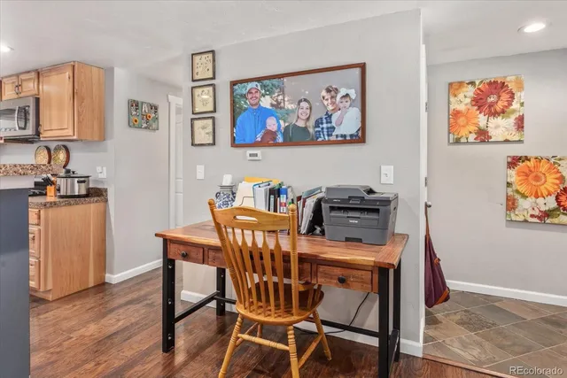 a view of a dining room with furniture and wooden floor