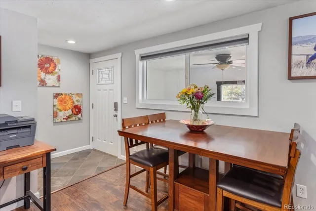 a view of a dining room with furniture wooden floor and a chandelier