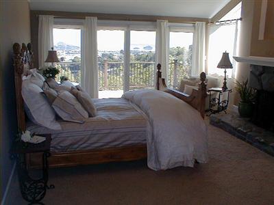 24 McCoy Road San Rafael, CA 94901 - Photo 4 of 12 a bedroom with a bed chair and a large window